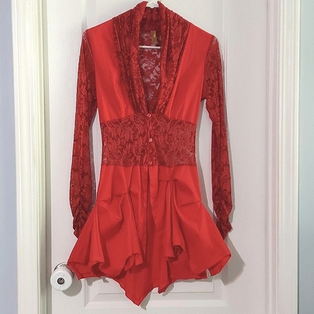 Lace top with ruched long sleeves and a ruffled waterfall bottom